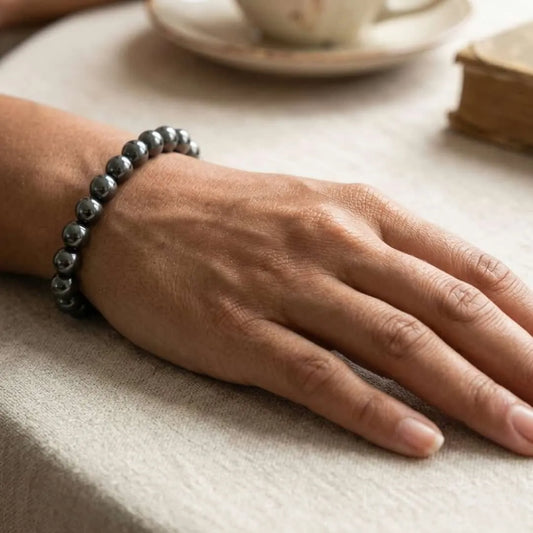 8mm hematite bracelet with smooth round beads on wrist